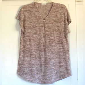 Soft Tee with zipper from collar to mid length.  Short sleeves.  Curved hemline.